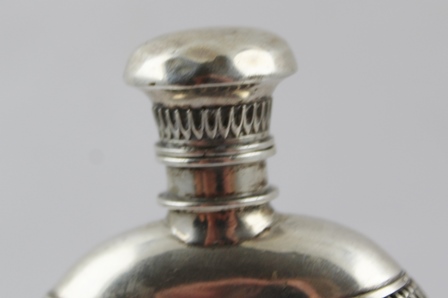 A CONTINENTAL WHITE METAL MOUNTED NUT SCENT BOTTLE with hinged cover, blind shield cartouche, raised - Image 2 of 2