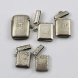 A COLLECTION OF FIVE HALLMARKED SILVER VESTA CASES, includes plain and chased, overall weight 109g.