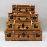 A GRADUATED SET OF FOUR "GIOVANNI" LEATHER SUITCASES with strap fastenings, larges 76cm wide,