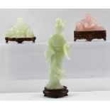 A PINK ROSE QUARTZ CARVED SEATED FIGURE OF BUDDHA, 6cm high, on a pierced carved wooden stand,