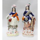 A PAIR OF VICTORIAN STAFFORDSHIRE POTTERY FIGURES, he wears Highland costume, 28.5cm high