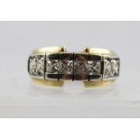 A GOLD CONTEMPORARY DESIGN DIAMOND RING in rub-over setting, having four square cut stones,