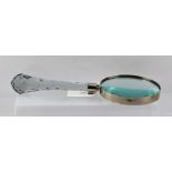 A LARGE MAGNIFYING GLASS with facet cut handle, diameter of lens 14.5cm, overall length 37cm