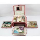 A SELECTION OF COSTUME JEWELLERY; rings, earrings, brooches, necklaces etc. housed in a pink