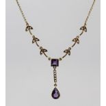 A GOLD AMETHYST AND DIAMOND NECKLACE having leaf linked chain set with small diamonds, central