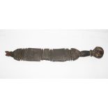 AN EARLY 19TH CENTURY CARVED HARDWOOD TUAREG TENT POLE TOP with large knop pommel, and incised