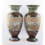 A PAIR OF LATE 19TH CENTURY DOULTON LAMBETH VASES of baluster form, decorated with cattle by