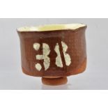 MO JUPP A STUDIO POTTERY SLIP GLAZED TERRACOTTA TEA BOWL, bearing the number "38", incised potter'