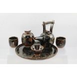 ALAN BIRCHALL A STUDIO POTTERY GLAZED STONEWARE TEA SET, of Japanese influence, comprising a tray