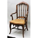 A CONTINENTAL STAINED BEECH FRAMED OPEN ARM HALL CHAIR having fluted shaped crest rail with turned