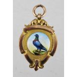 A GOLD AND ENAMELLED PRESENTATION FOB, with circular plaque decorated with a pigeon, inscribed