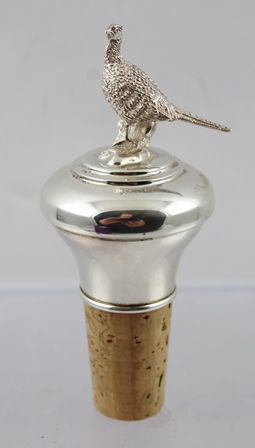 AN EARLY 21ST CENTURY SILVER MOUNTED CORK BOTTLE STOPPER with a cast pheasant knop, Birmingham 2004,