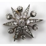 A VICTORIAN SILVER AND GOLD DIAMOND SET SIX-POINT STAR BROOCH, having a central round old cut