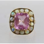 A 9CT GOLD LARGE KUNZITE AND OPAL DRESS RING, having central tablet cut Kunzite stone surrounded