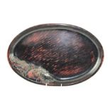 A JAPANESE OVAL LACQUER TRAY, with raised bridge in landscape decoration, 45cm x 29cm