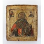 19TH CENTURY RUSSIAN SCHOOL AN ICON half length of The Christ Pantocrator holding the Holy Book,