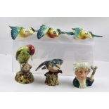 FOUR BESWICK EARTHENWARE MODELS OF BIRDS, including three wall mounted Kingfishers in flight, 15-