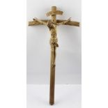 A CONTINENTAL CARVED WOOD CRUCIFIX in the style of Matthias Grunewald's Christ on the Cross in the