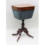 A 19TH CENTURY MAHOGANY REGENCY DESIGN SEWING TABLE the canted top with hinged opening to reveal