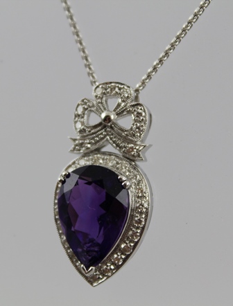 A WHITE GOLD AMETHYST AND DIAMOND NECKLACE, having clover leaf encrusted with diamonds above an - Image 2 of 5