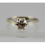 A BRILLIANT CUT SOLITAIRE DIAMOND RING, set in an 18ct gold band