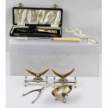 A PAIR OF SILVER PLATED GRAPE SCISSORS, cast vine design, A CHEESE SCOOP, a cased PICKLE FORK, TWO