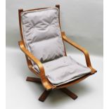 A BENTWOOD FRAMED SWEDISH STYLE RECLINING ARMCHAIR with thin part buttoned back and seat pad