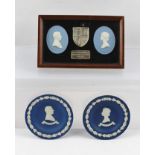 A FRAMED PAIR OF WEDGWOOD CAMEO PLAQUES of Queen Elizabeth II and the Duke of Edinburgh flanking a