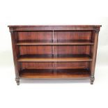 A VICTORIAN INVERTED BREAKFRONT MAHOGANY BOOKCASE, flanked by fluted half columns on turned feet,