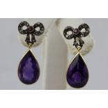 A PAIR OF AMETHYST AND DIAMOND DROP EARRINGS, having diamond set bow with central small circular