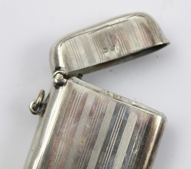 A COLLECTION OF FIVE HALLMARKED SILVER VESTA CASES, includes plain and chased, overall weight 109g. - Image 4 of 4