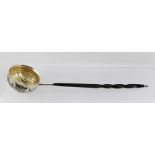 FRANCIS BOONE THOMAS & CO. A VICTORIAN SILVER TODDY LADLE having floral decorated repousse bowl,