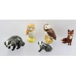 A COLLECTION OF BESWICK EARTHENWARE FIGURES OF BIRDS AND ANIMALS including a seated fox, two badgers