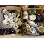 Two boxes of assorted ornaments, ceramics and glassware.