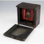 A Junior Sanderson brass and mahogany ¼ plate camera fitted with Koylos shutter and lens