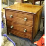 A 20th Century mahogany felt lined box in the form of a chest of drawers.