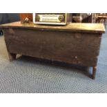 An early 20th Century oak coffer with hinged lid.