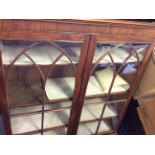 An oak bookcase top with gothic pointed arch double lunette glass doors.