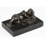 A late 18th / early 19th Century hollow cast bronze depicting a sleeping child on a cross mounted on