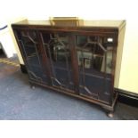 A mahogany three door china cabinet with astra glazed doors.