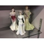 Three porcelain classical female figures.