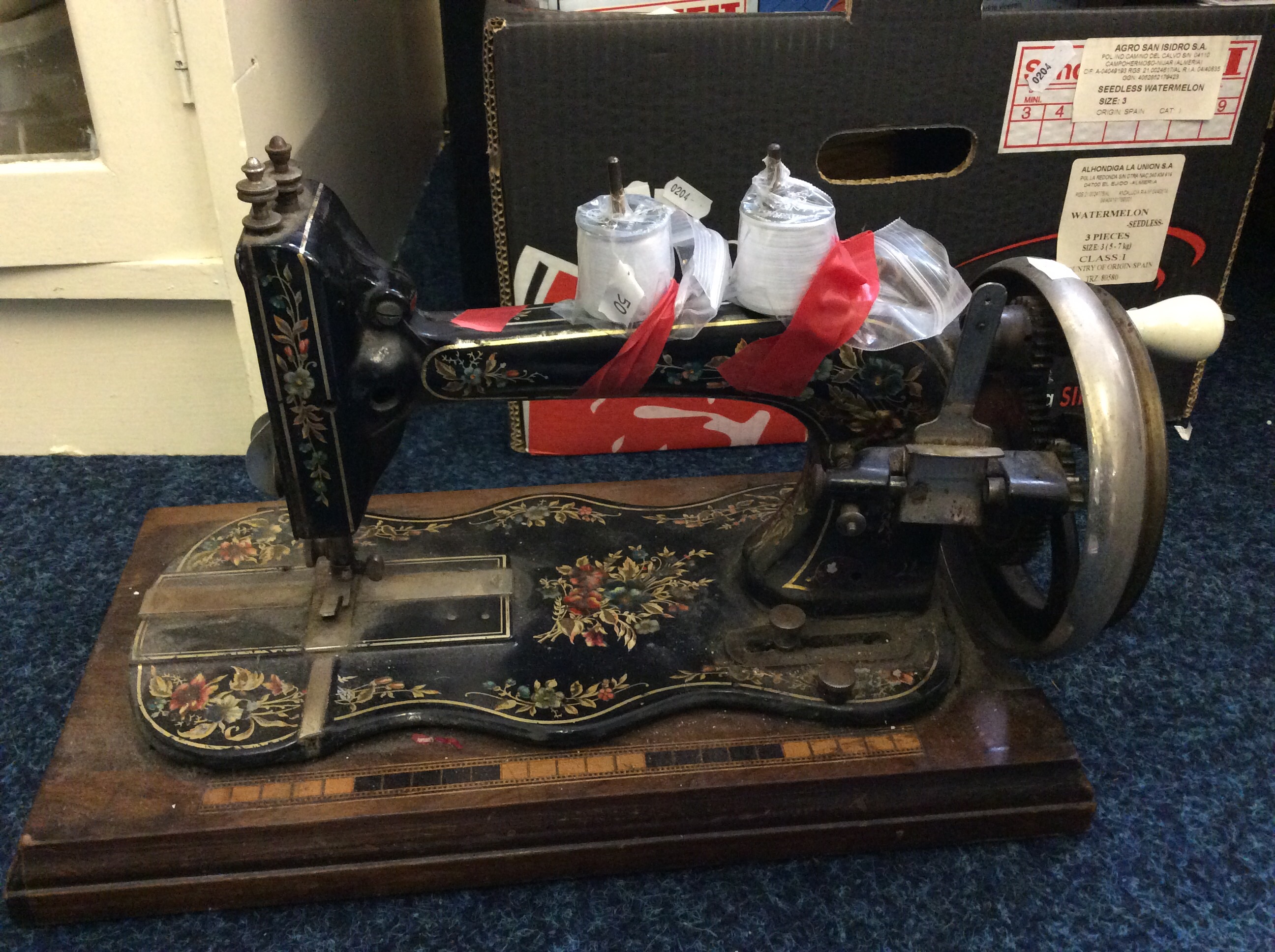 A sewing machine with floral detail.