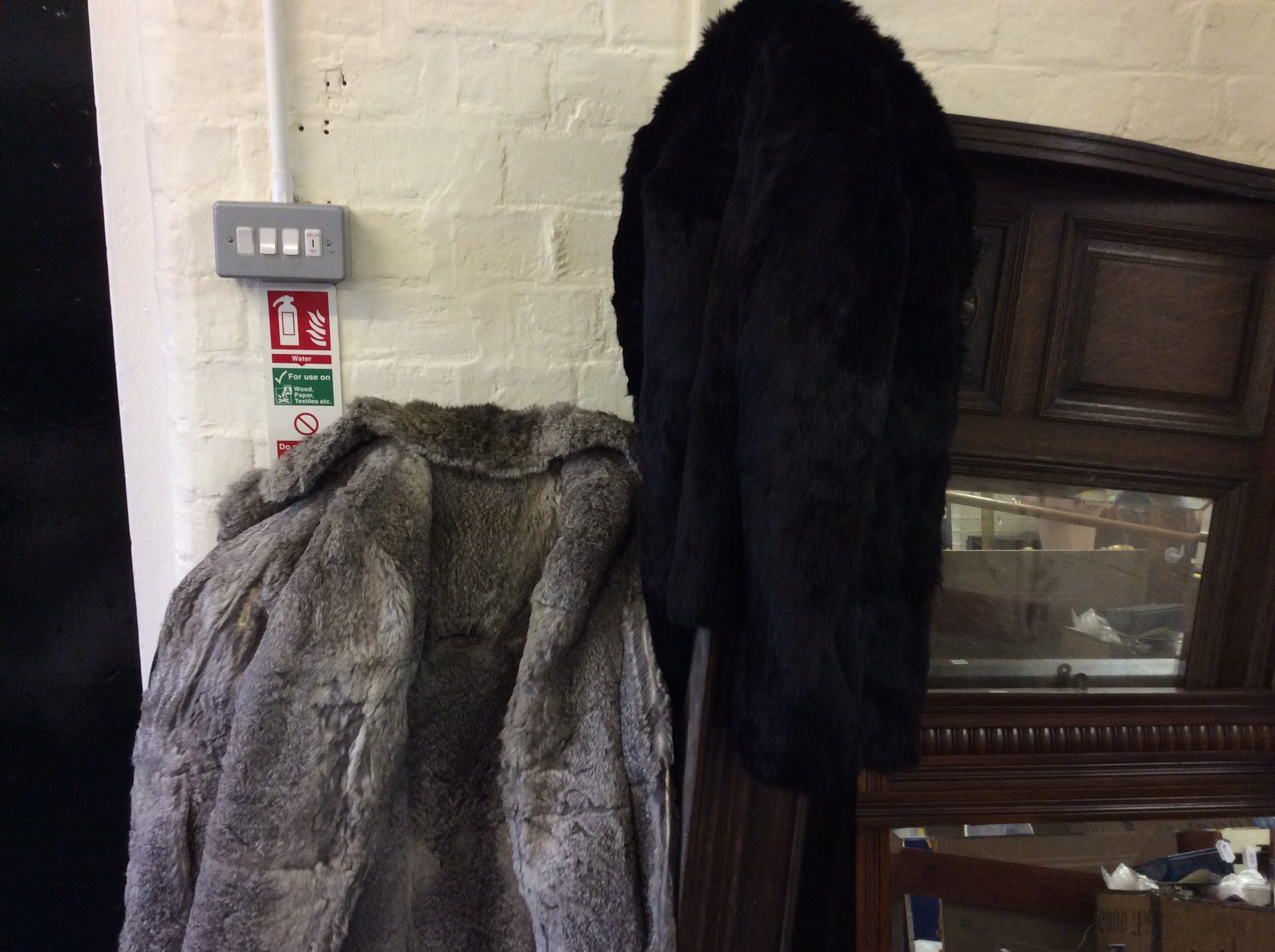 Two real fur Golden Swallow coats.