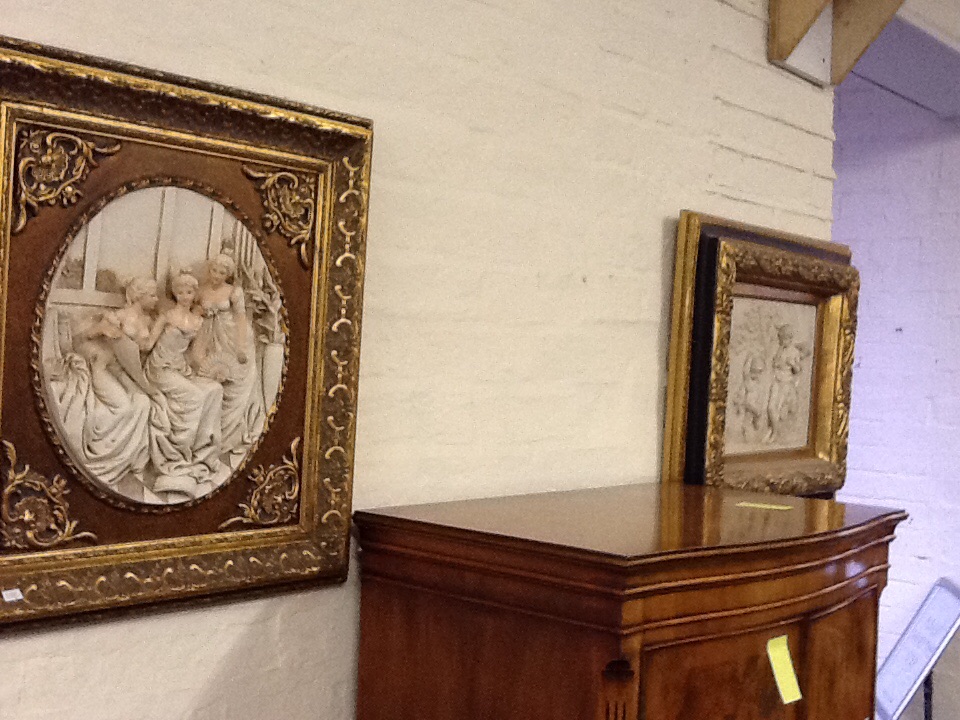 A two decorative pictures with gilt frames.