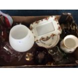 A box containing various items to include an assortment of glassware, commemorative plates and Royal