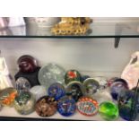 *Twenty six glass paperweights, one cut glass, some with flower and swirl interiors, including a