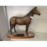 A Beswick race horse figurine on wooden base titled 'Psalm'.