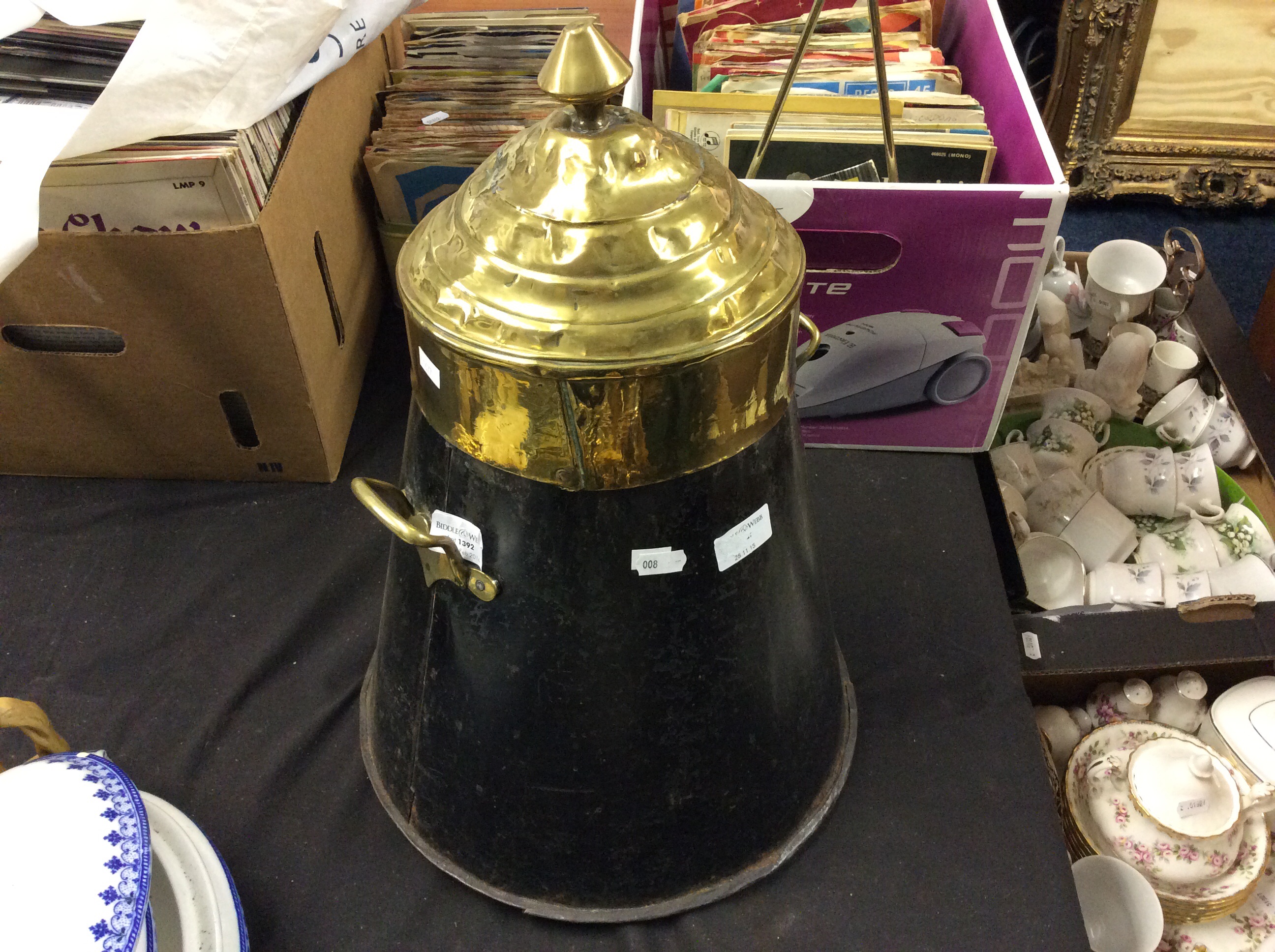 A brass topped coal box.