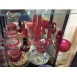 A selection of cranberry coloured glassware.