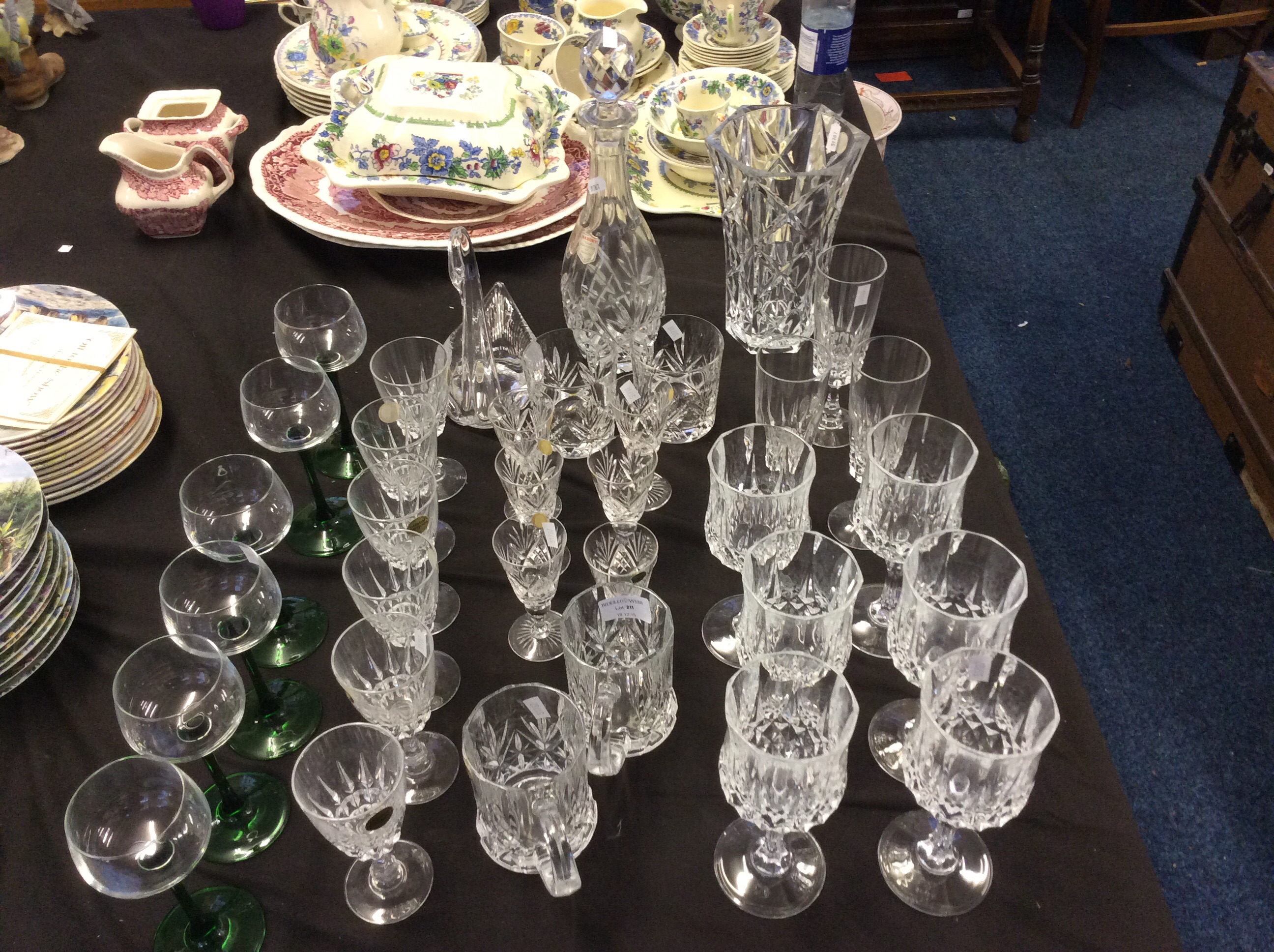 A collection of cut glass to include a decanter and a swan